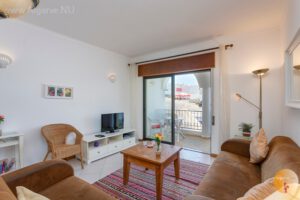 South-facing balcony and walk along the opposite street to the coast.