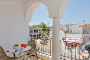 With a balcony on the sunny south side.