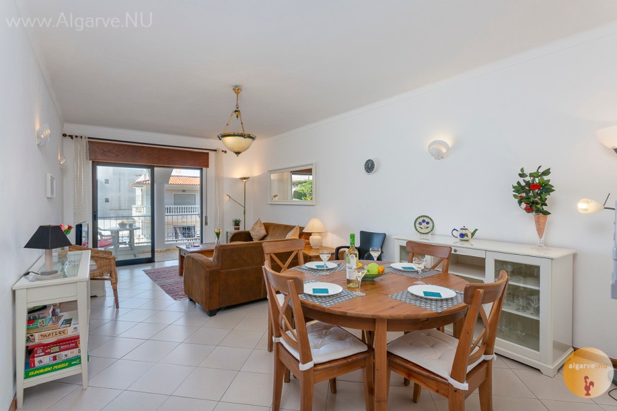 Spacious living-dining room with air conditioning, wi-fi, satellite TV, and a nice south-facing balcony.