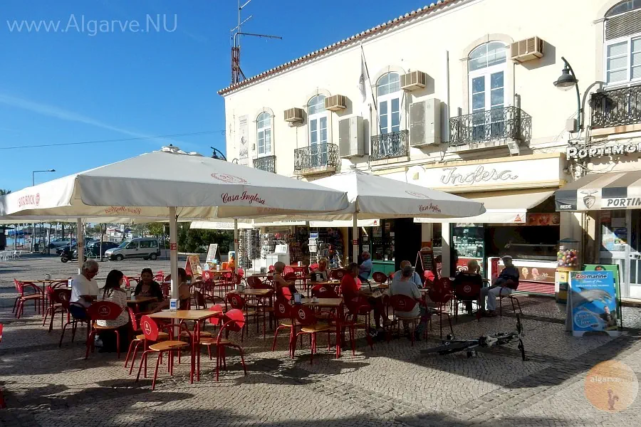 Drinking and dining at the city square from Portimao, located at the river.